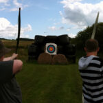 archery with two people at house of mulben