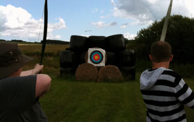 archery with two people at house of mulben