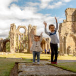 Children playing outside Elgin Cathedral