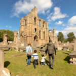 A family outside Elgin Cathedral