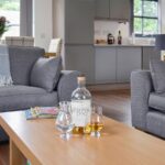 Picture of Glen Feshie Holiday Cottage living room with whisky