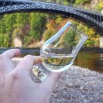 Picture of white whisky taken next to a river