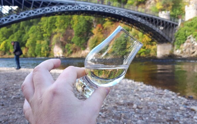 Picture of white whisky taken next to a river