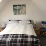 A double bed in Beach House FIndochty