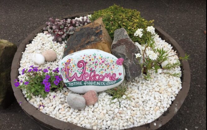 stone with welcome written on it