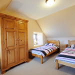 Sea Breeze Cottage Bedroom with two single beds