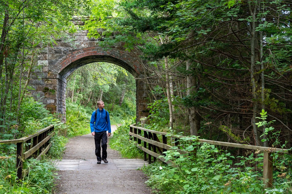 Man walking along the speyside way