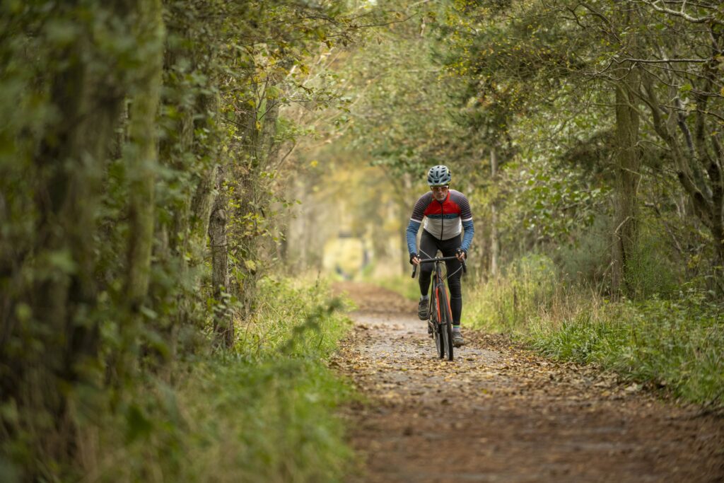 Man cycling in forest
