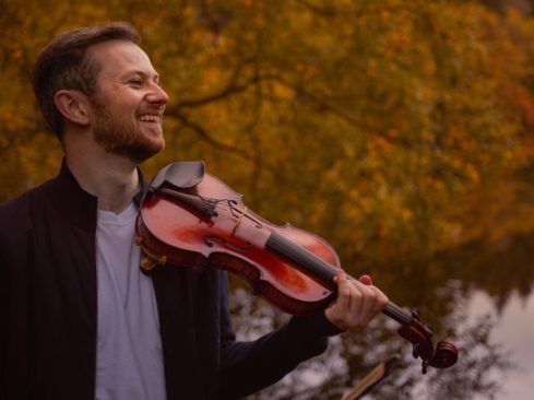 Man holding a fiddle