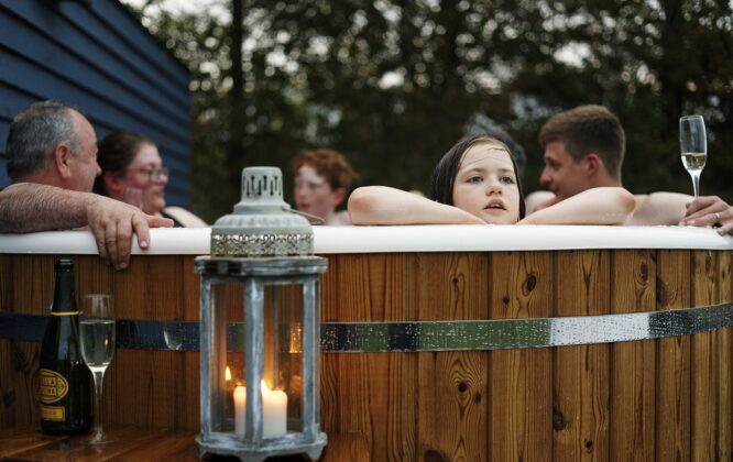 Picture of family in hot tub at The Loft