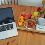 Picture of fruit tray and laptop at Carden Holiday Cottage