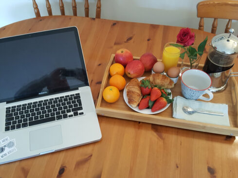 Picture of fruit tray and laptop at Carden Holiday Cottage