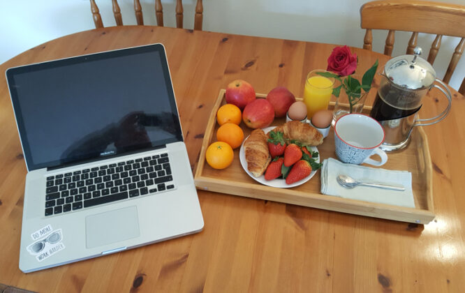 Picture of fruit tray and laptop at Carden Holiday Cottage